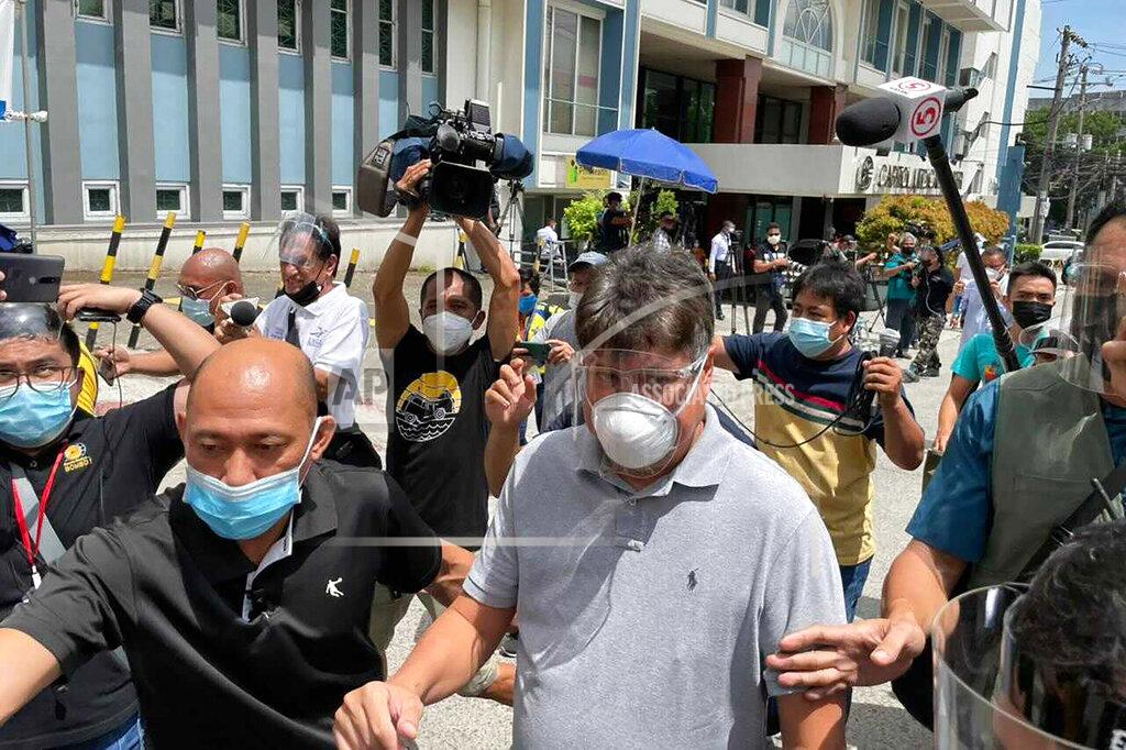 Former senator Francis “Kiko” Pangilinan, center, leaves Capitol Medical Center where former Philippine President Benigno Aquino III was transported in Quezon city, Philippines Thursday, June 24, 2021. (AP Photo/Joeal Calupitan)