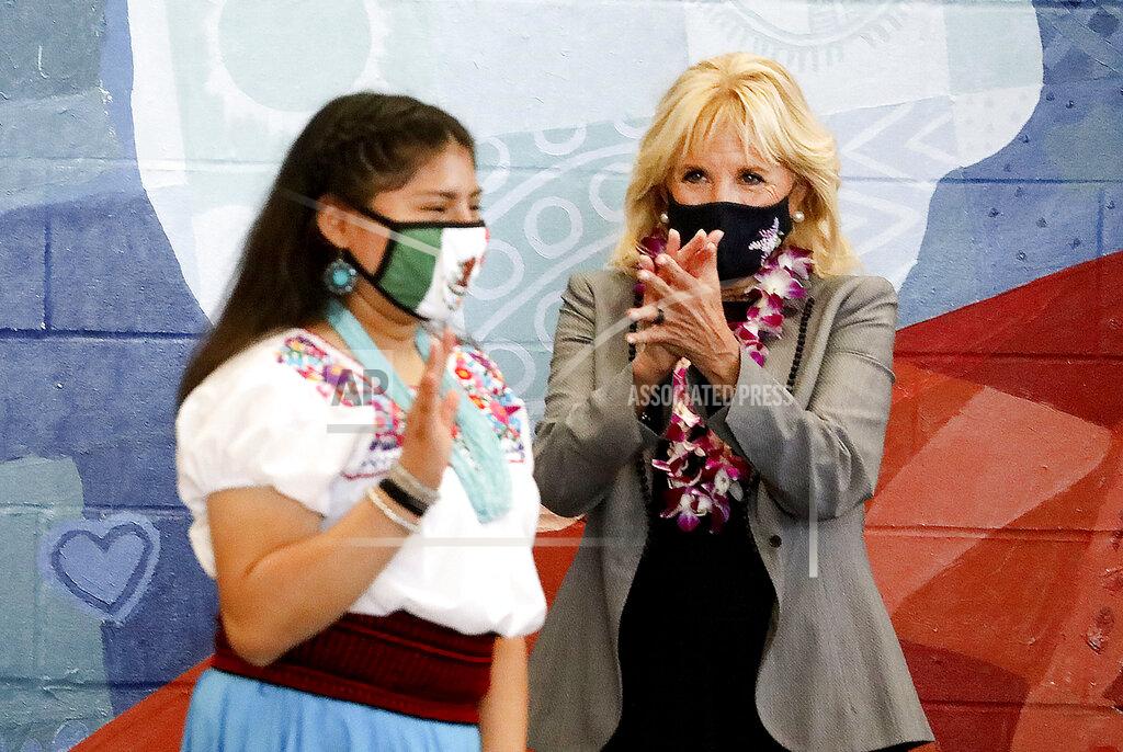 Laura Seitz Glendale Middle School eighth grader Rosa Sanchez receives applause from first lady Jill Biden as she walks to the podium to speak at Glendale Middle School in Salt Lake City, Wednesday, May 5, 2021. Biden visited the school to thank teachers for their diligence and hard work during the pandemic. (Laura Seitz/The Deseret News via AP)