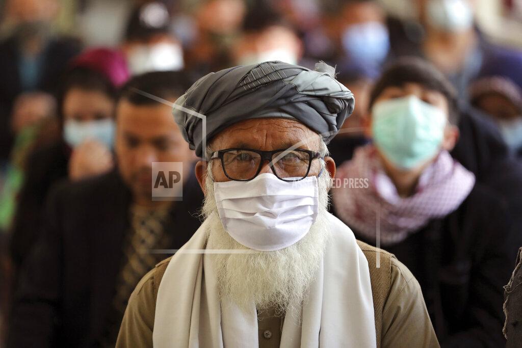 Rahmat Gul Afghan people wait to receive the Indian version of the AstraZeneca coronavirus vaccine at a hospital in Kabul, Afghanistan, Tuesday, May 11, 2021. (AP Photo/Rahmat Gul)