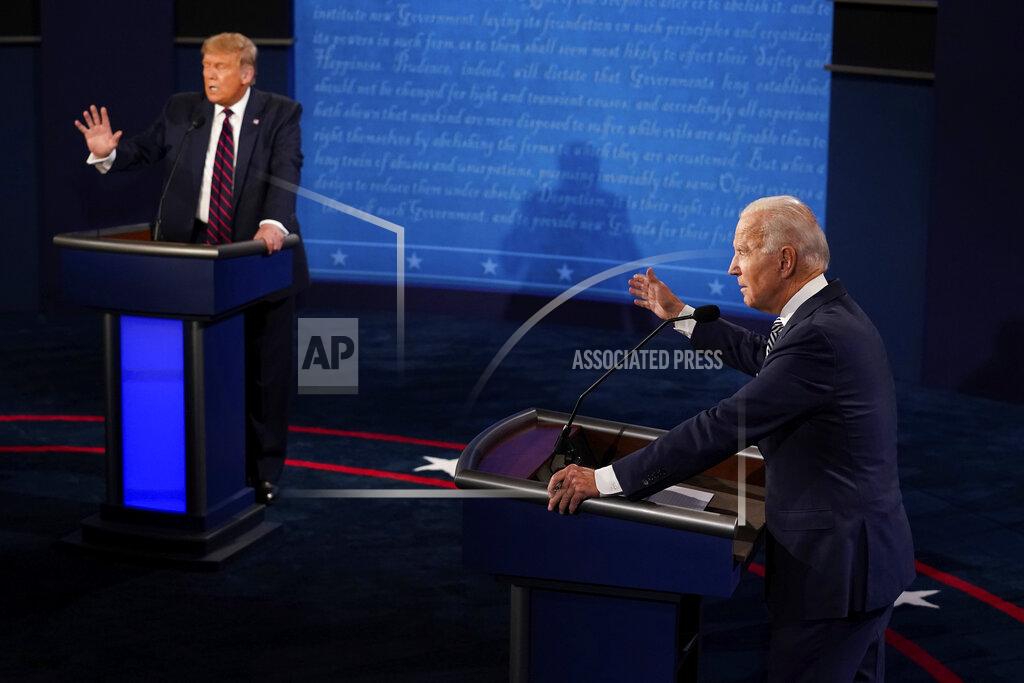 Morry Gash FILE - In this Sept. 29, 2020, file photo President Donald Trump and Democratic presidential candidate former Vice President Joe Biden exchange points during their first presidential debate at Case Western University and Cleveland Clinic, in Cleveland, Ohio. (AP Photo/Morry Gash, Pool, File)