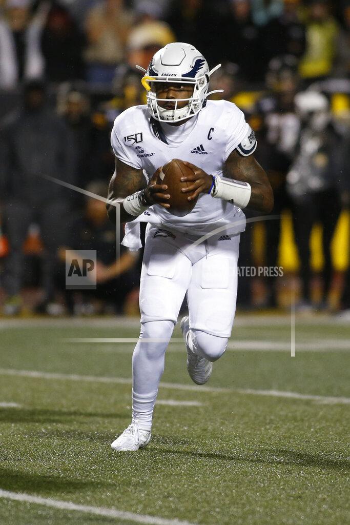 Brian Blanco Georgia Southern quarterback Shai Werts (1) looks for an open receiver during the first half of the team's NCAA college football game against Appalachian State on Thursday, Oct. 31, 2019, in Boone, N.C. (AP Photo/Brian Blanco)