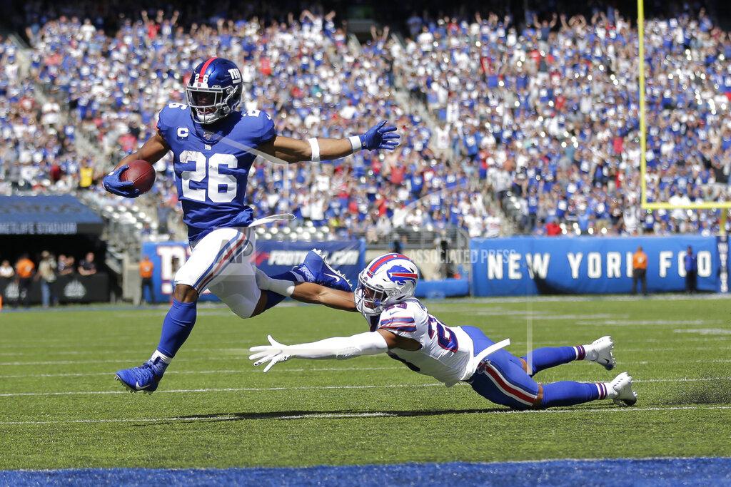 Adam Hunger New York Giants running back Saquon Barkley (26) breaks away for a touchdown during the first half of an NFL football game against the Buffalo Bills, Sunday, Sept. 15, 2019, in East Rutherford, N.J. (AP Photo/Adam Hunger)