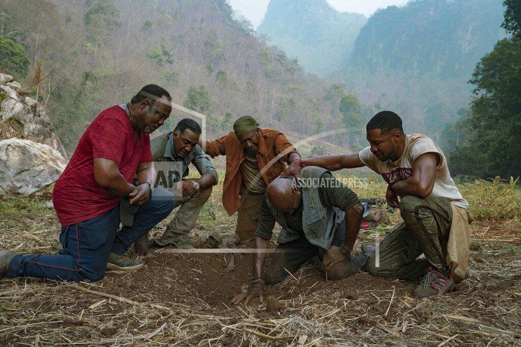 David Lee This image released by Netflix shows, from left, Isiah Whitlock Jr., Norm Lewis, Clarke Peters, Delroy Lindo and Jonathan Majors in a scene from the Spike Lee film "Da 5 Bloods." (David Lee/Netflix via AP)