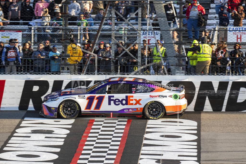 Mike Caudill Denny Hamlin crosses the finish line to win the NASCAR Cup Series auto race at Richmond Raceway on Sunday, April 3, 2022, in Richmond, Va. (AP Photo/Mike Caudill)