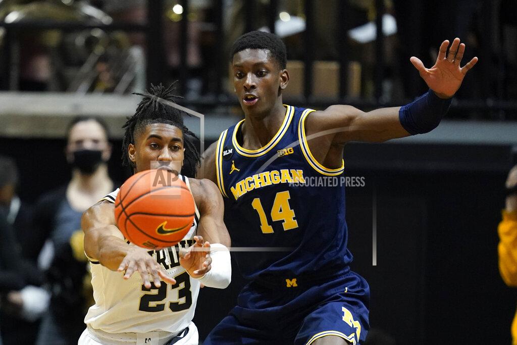 Darron Cummings Purdue guard Jaden Ivey (23) makes a pass against Michigan forward Moussa Diabate (14) during the first half of an NCAA college basketball game, Saturday, Feb. 5, 2022, in West Lafayette, Ind. (AP Photo/Darron Cummings)