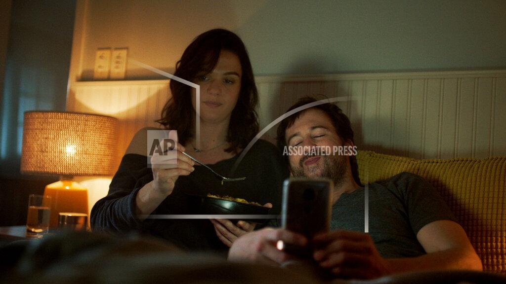Uncredited This undated image provided by Devour shows a scene from Kraft Heinz' frozen-food brand Devour's Super Bowl debut. Devour is trying to make waves during its Super Bowl debut with an ad taking a humorous jab at one man's "frozen food porn addiction." (Devour via AP)