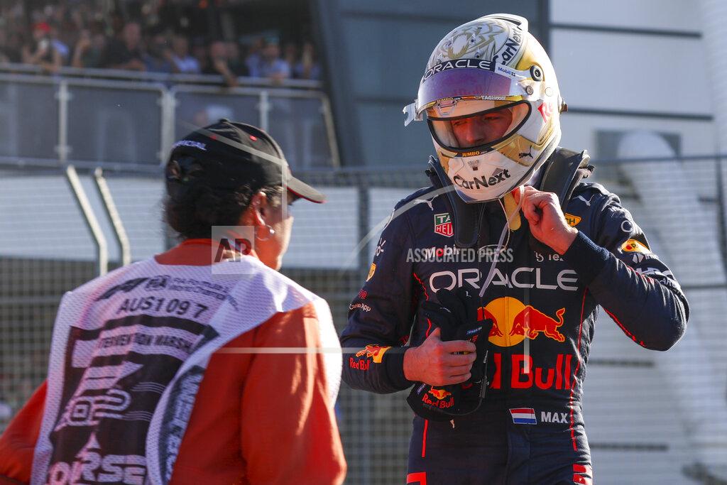 Asanka Brendon Ratnayake Red Bull driver Max Verstappen of the Netherlands looks at his car after he withdrew from the Australian Formula One Grand Prix in Melbourne, Australia, Sunday, April 10, 2022. (AP Photo/Asanka Brendon Ratnayake)