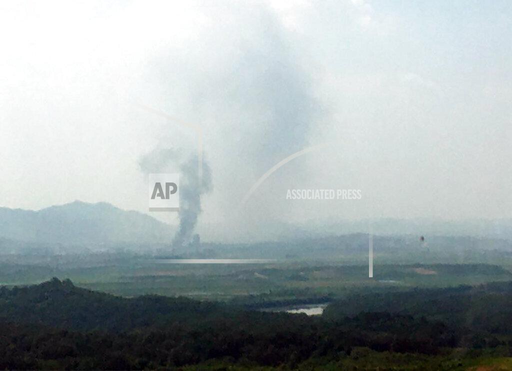 Smoke rises in the North Korean border town of Kaesong, seen from Paju, South Korea, Tuesday, June 16, 2020. South Korea says that North Korea has exploded an inter-Korean liaison office building just north of the tense Korean border. (Yonhap via AP)