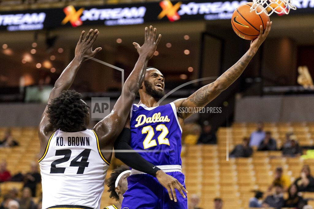 L.g. Patterson Paul Quinn's Quintin Hudson, right, shoots past Missouri's Kobe Brown, left, during the first half of an NCAA college basketball game Monday, Nov. 29, 2021, in Columbia, Mo. (AP Photo/L.G. Patterson)