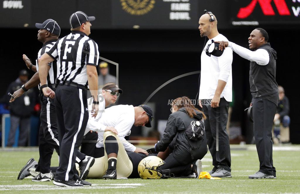 Mark Humphrey Vanderbilt head coach Derek Mason, right, yells at the Florida bench as Vanderbilt defensive lineman Dare Odeyingbo is attended to in the first half of an NCAA college football game Saturday, Oct. 13, 2018, in Nashville, Tenn. (AP Photo/Mark Humphrey)