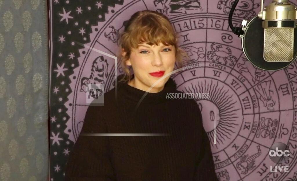 Uncredited In this screen shot provided by ABC on Sunday, Nov. 22, 2020, Taylor Swift accepts the award for artist of the year at the American Music Awards at the Microsoft Theater in Los Angeles. (ABC via AP)