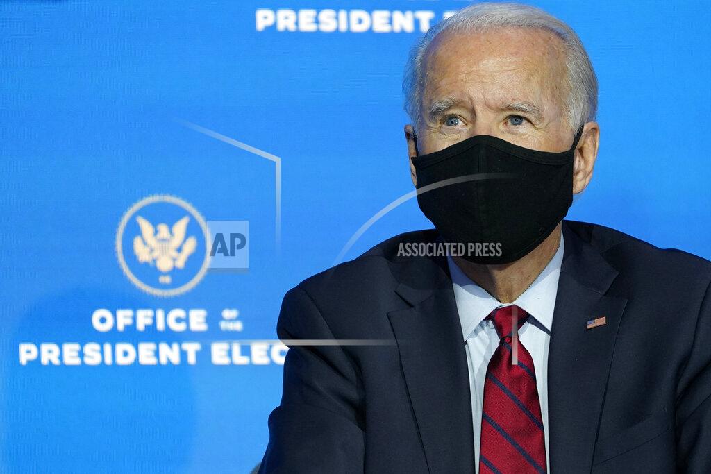 Susan Walsh President-elect Joe Biden listens during an event at The Queen theater in Wilmington, Del., Tuesday, Dec. 8, 2020, to announce his health care team. (AP Photo/Susan Walsh)