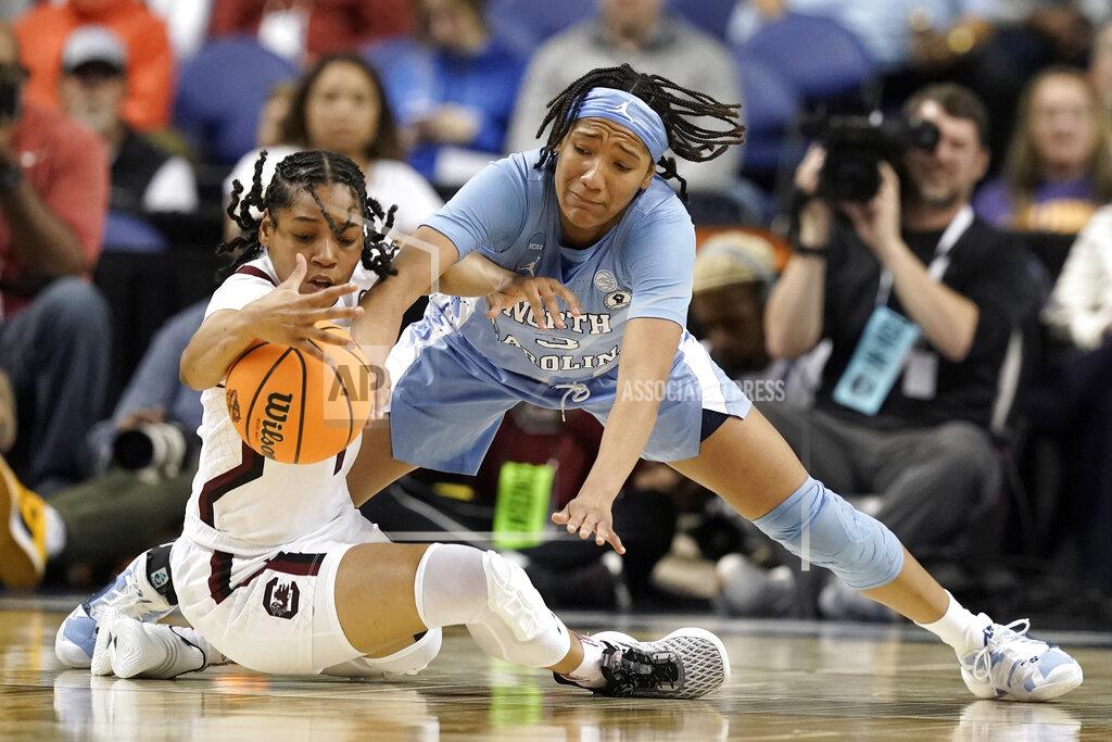 Gerry Broome South Carolina guard Zia Cooke, left, and North Carolina guard Kennedy Todd-Williams (3) reach for the ball during the first half of a college basketball game in the Sweet 16 round of the NCAA tournament in in Greensboro, N.C., Friday, March 25, 2022. (AP Photo/Gerry Broome)