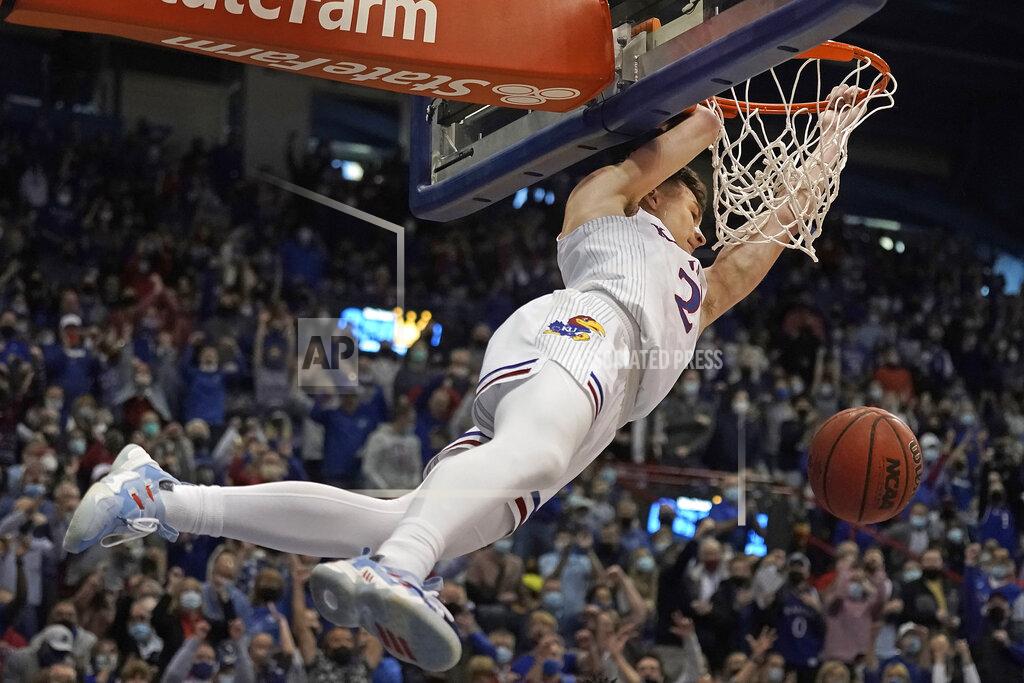 Charlie Riedel Kansas guard Christian Braun dunks the ball during the first half of an NCAA college basketball game against Baylor Saturday, Feb. 5, 2022, in Lawrence, Kan. (AP Photo/Charlie Riedel)