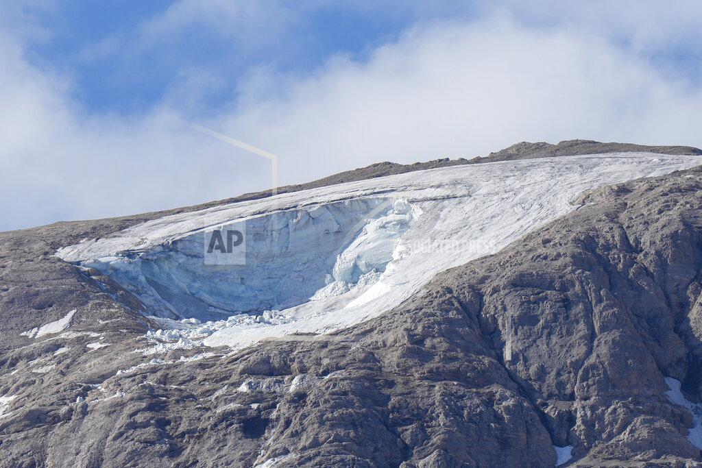 Luca Bruno A view of the Punta Rocca glacier near Canazei, in the Italian Alps in northern Italy, Tuesday, July 5, 2022, two day after a huge chunk of the glacier broke loose, sending an avalanche of ice, snow, and rocks onto hikers. (AP Photo/Luca Bruno)