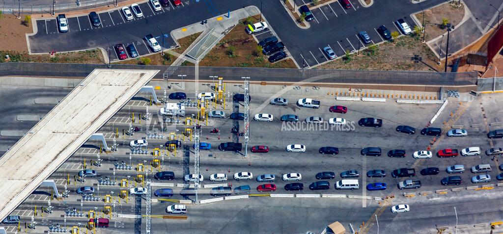 Mark Holtzman FILE - This April 2, 2019, file photo shows the port of entry from Mexicali, Mexico to Calexico, Calif. An increasing number of American citizens have been apprehended as they have tried to smuggle illegal drugs into the U.S. since the start of the coronavirus pandemic, an uptick that's come amid travel restrictions at the border with Mexico. (Mark Holtzman/West Coast Aerial Photography Inc. via AP,File)