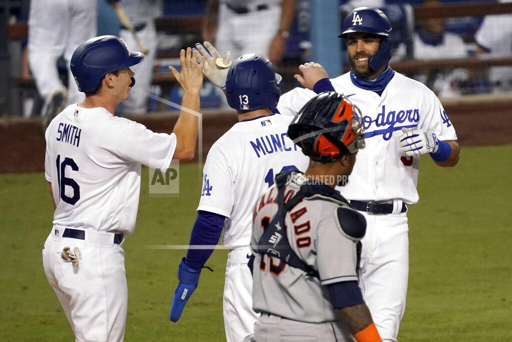 Alex Gallardo Los Angeles Dodgers' Chris Taylor, right, gets congratulations from Will Smith, left, and Max Muncy after hitting a three-run home run, with Houston Astros catcher Martin Maldonado, foreground, watching, during the eighth inning of a baseball game in Los Angeles, Sunday, Sept. 13, 2020. (AP Photo/Alex Gallardo)