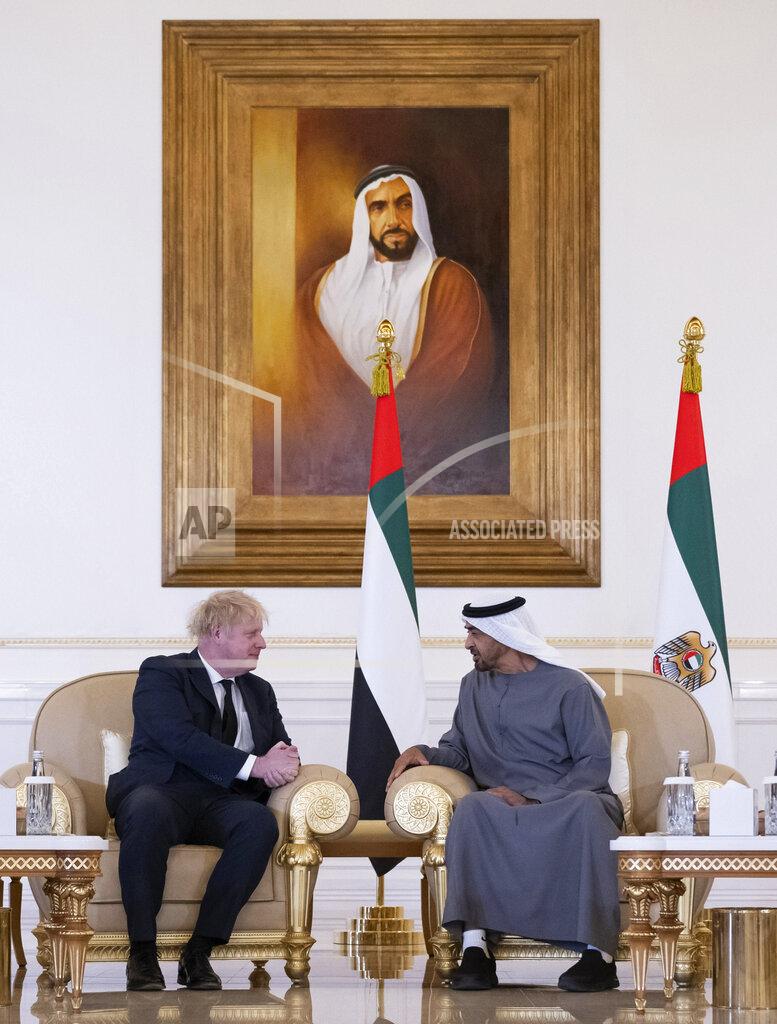 Rashed Al Mansoori This photo made available by the Ministry of Presidential Affairs shows, the Prime Minister of the United Kingdom Boris Johnson, left, offering his condolences to Sheikh Mohamed bin Zayed Al Nahyan, President of the UAE and Ruler of Abu Dhabi, on the passing of Sheikh Khalifa bin Zayed Al Nahyan, late President of the UAE, in Abu Dhabi, UAE, Sunday, May 15, 2022. (Rashed Al Mansoori/Ministry of Presidential Affairs via AP)