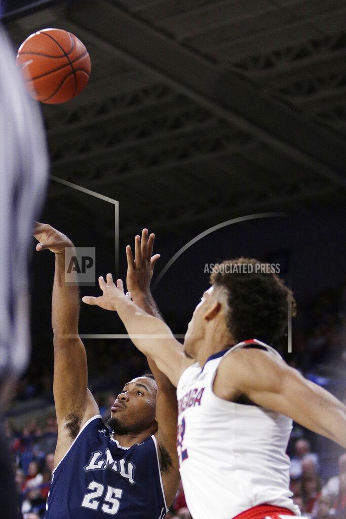 Young Kwak Loyola Marymount guard Jeffery McClendon (25) shoots while defended by Gonzaga forward Jeremy Jones during the second half of an NCAA college basketball game in Spokane, Wash., Thursday, Jan. 17, 2019. Gonzaga won 73-55. (AP Photo/Young Kwak)