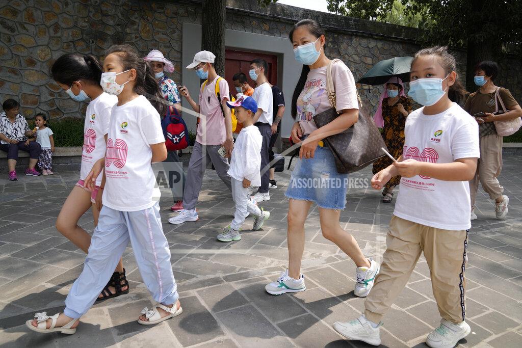 Ng Han Guan Tourists wear face masks as they visit the Summer Palace in Beijing Tuesday, Aug. 3, 2021. The current coronavirus outbreaks in China, while still in the hundreds of cases in total, have spread much more widely than previous ones, reaching multiple provinces and cities including the capital, Beijing. Many of the cases have been identified as the highly contagious delta variant that is driving a resurgence in many countries. (AP Photo/Ng Han Guan)
