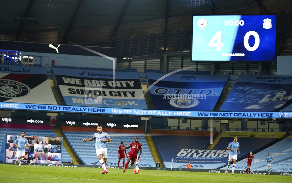Dave Thompson Scoreboard shows the final score during the English Premier League soccer match between Manchester City and Liverpool at Etihad Stadium in Manchester, England, Thursday, July 2, 2020. (AP Photo/Dave Thompson,Pool)
