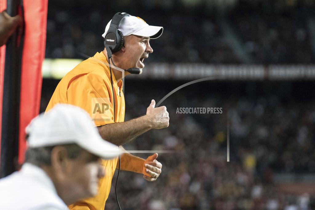 Sean Rayford Tennessee head coach Jeremy Pruitt communicates with players during the first half of an NCAA college football game against South Carolina, Saturday, Oct. 27, 2018, in Columbia, S.C. (AP Photo/Sean Rayford)