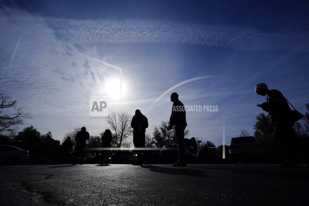 Matt Slocum People wait outside a polling place to cast their ballots in the 2020 general election in the United States, Tuesday, Nov. 3, 2020, in Media, Pa. (AP Photo/Matt Slocum)