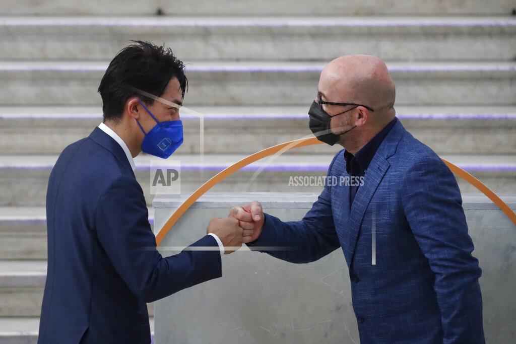 Salvatore Laporta Japan's Environment Minister Shinjirō Koizumi is welcomed by Italian Minister for Ecological Transition Roberto Cingolani as he arrives at Palazzo Reale in Naples, Italy, Thursday, July 22, 2021, to take part in a G20 meeting on environment, climate and energy. (AP Photo/Salvatore Laporta)