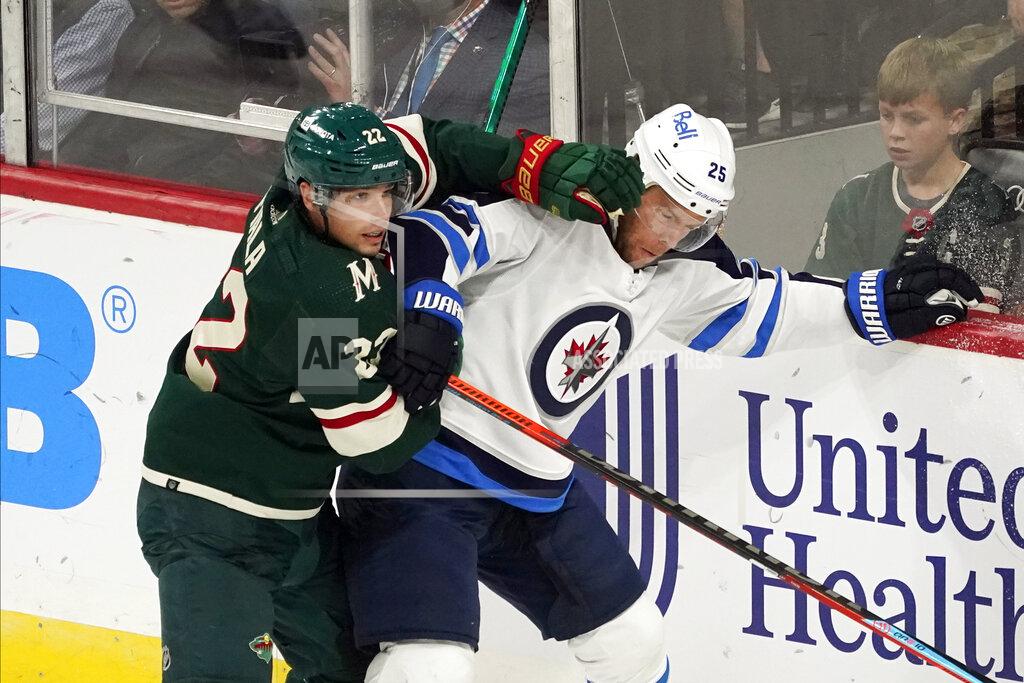 Jim Mone Minnesota Wild's Kevin Fiala (22) defends against Winnipeg Jets' Paul Stastny (25) during the first period of an NHL hockey game Tuesday, Oct. 19, 2021, in St. Paul, Minn. (AP Photo/Jim Mone)