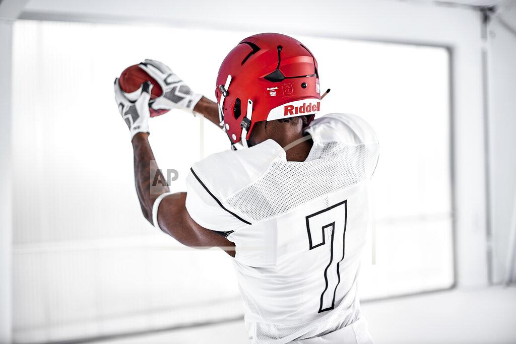 This photo provided by Riddell shows former NCAA college football athlete and profession model Wes Jordan wearing an Axion helmet at Natural Light Studio in Dallas, Texas, Oct. 28, 2021. Riddell has developed a football helmet that might not be just the next big step in design and player safety, but a major leap. (Michael Khachadoorian/Riddell via AP)