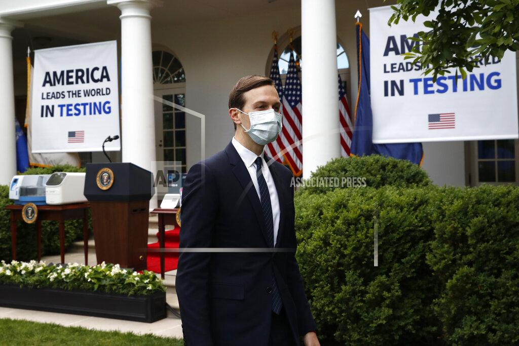 Wearing a mask, White House adviser Jared Kushner leaves after President Donald Trump spoke about the coronavirus during a press briefing in the Rose Garden of the White House, Monday, May 11, 2020, in Washington. (AP Photo/Alex Brandon)