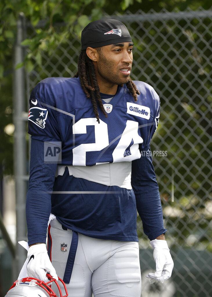 New England Patriots cornerback Stephon Gilmore steps on the field at the start of an NFL football training camp practice, Thursday, Aug. 1, 2019, in Foxborough, Mass. (AP Photo/Steven Senne)