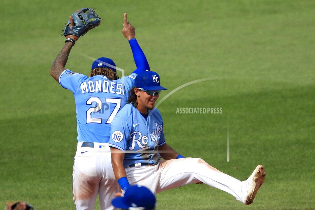 Orlin Wagner Kansas City Royals shortstop Adalberto Mondesi (27) and second baseman Nicky Lopez, right, celebrate following a baseball game against the Minnesota Twins at Kauffman Stadium in Kansas City, Mo., Sunday, Aug. 9, 2020. (AP Photo/Orlin Wagner)