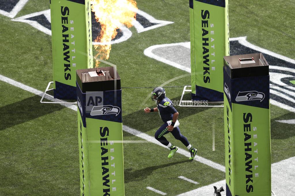 Stephen Brashear Seattle Seahawks quarterback Russell Wilson runs out of the tunnel during player introductions before an NFL football game against the Cincinnati Bengals, Sunday, Sept. 8, 2019, in Seattle. (AP Photo/Stephen Brashear)