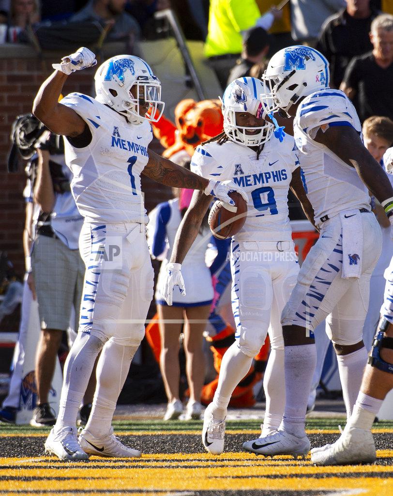 L.g. Patterson Memphis wide receiver Tony Pollard, left, celebrates his touchdown with teammates during the first half of an NCAA college football game against Missouri, Saturday, Oct. 20, 2018, in Columbia, Mo. (AP Photo/L.G. Patterson)