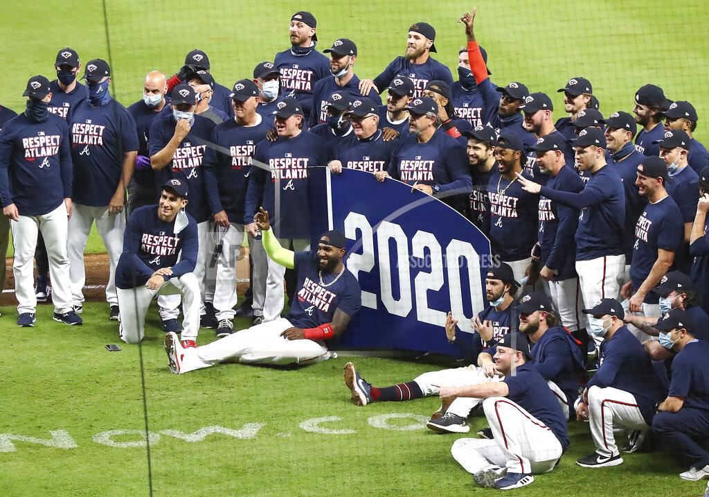 Curtis Compton The Atlanta Braves celebrate clinching their third consecutive National League East championship after with a victory over the Miami Marlins in a baseball game on Tuesday, Sept. 22, 2020, in Atlanta. (Curtis Compton/Atlanta Journal-Constitution via AP)
