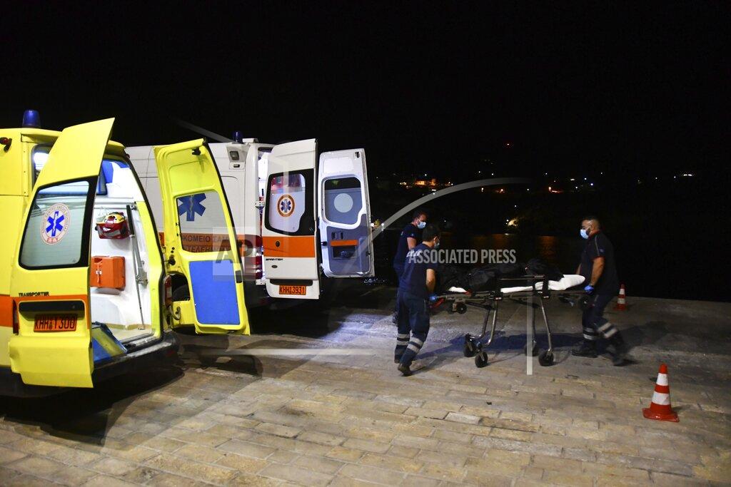 Michael Svarnias Paramedics wheel a gurney with a body at Pythagorio port, on the eastern Aegean island of Samos, Greece, late Monday, Sept. 13, 2021. Authorities in Greece Tuesday opened an investigation into the crash of a private plane from Israel that killed a prosecution witness in the corruption trial of former Israeli prime minister Benjamin Netanyahu. Haim Geron, a former senior official at Israel's ministry of communications, and his wife Esther were killed in the crash late Monday off the island of Samos. (AP Photo/Michael Svarnias)