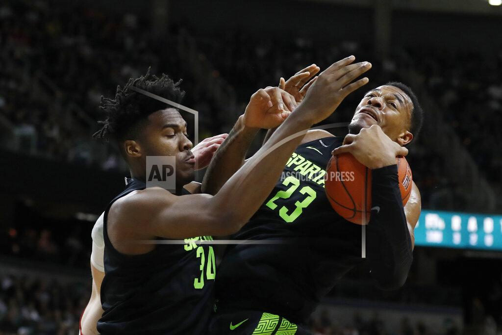 Carlos Osorio Michigan State forward Xavier Tillman (23) grabs a rebound next to teammate Julius Marble (34) during the first half of an NCAA college basketball game against Wisconsin, Friday, Jan. 17, 2020, in East Lansing, Mich. (AP Photo/Carlos Osorio)