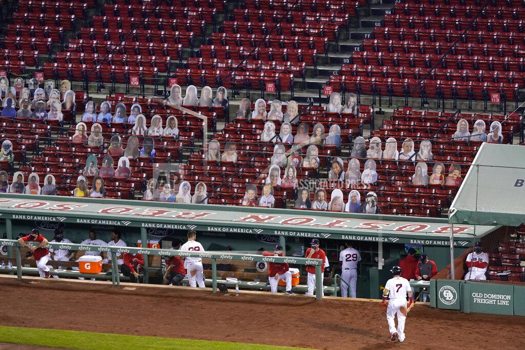 Charles Krupa Boston Red Sox's Christian Vazquez (7) walks back to the dugout after striking out to end the fourth inning, in a stadium without fans but featuring cardboard cutouts of people in seats, during a baseball game at Fenway Park in Boston, Thursday, Sept. 24, 2020. The Red Sox played their final home game of the COVID-19-disrupted season, against the Baltimore Orioles. (AP Photo/Charles Krupa)
