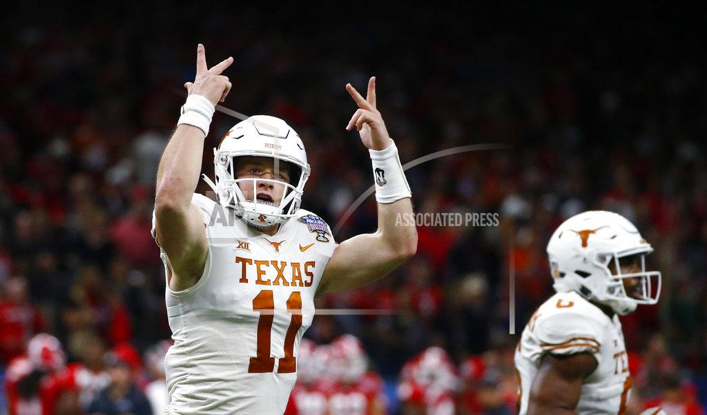 Butch Dill Texas quarterback Sam Ehlinger (11) reacts after a running touchdown during the first half of the Sugar Bowl NCAA college football game against Georgia in New Orleans, Tuesday, Jan. 1, 2019. (AP Photo/Butch Dill)