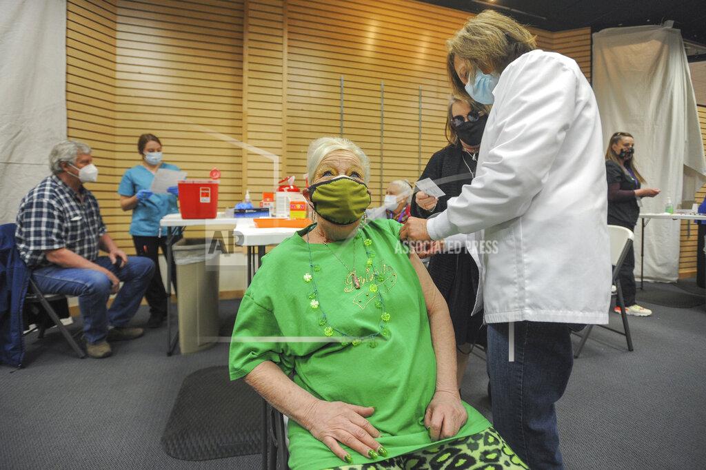 John Roark FILE - In this March 17, 2021, file photo, Kristy Stoos receives her COVID-19 inoculation at Grand Teton Mall in Idaho Falls, Idaho. As cases fall and states reopen, the potential final stage in the U.S. campaign to vanquish COVID-19 is turning into a slog, with a worrisome variant gaining a bigger foothold and lotteries and other inducements failing to persuade some Americans to get vaccinated. (John Roark/The Idaho Post-Register via AP, File)