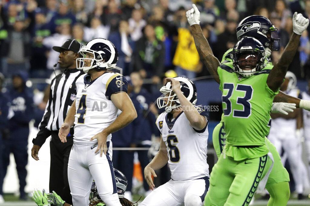 Elaine Thompson Los Angeles Rams' Greg Zuerlein (4) and Seattle Seahawks free safety Tedric Thompson (33) react after Zuerlein missed a field goal in the final seconds of an NFL football game Thursday, Oct. 3, 2019, in Seattle. The Seahawks won 30-29. (AP Photo/Elaine Thompson)