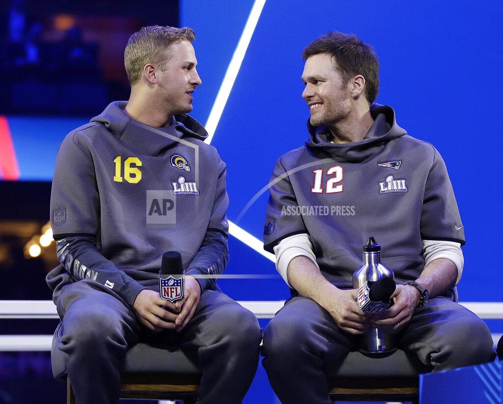 Matt Rourke Los Angeles Rams' Jared Goff talks to New England Patriots' Tom Brady during Opening Night for the NFL Super Bowl 53 football game Monday, Jan. 28, 2019, in Atlanta. (AP Photo/Matt Rourke)
