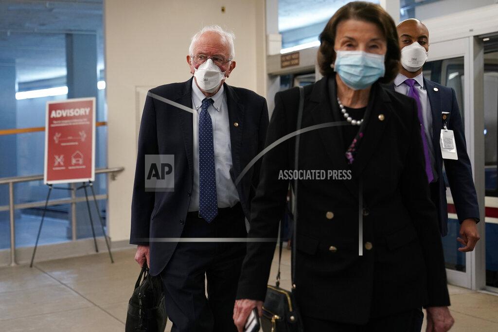 Susan Walsh Sen. Bernie Sanders, I-Vt., left, follows Sen. Dianne Feinstein, D-Calif., right, as they arrive for the second impeachment trial of former President Donald Trump on Capitol in Washington, Tuesday, Feb. 9, 2021. (AP Photo/Susan Walsh)