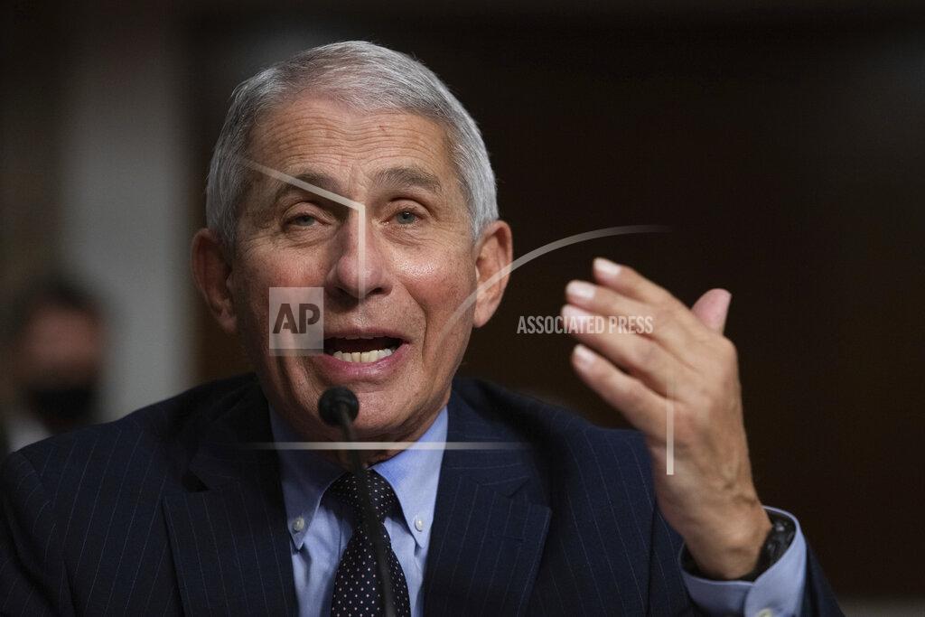 Graeme Jennings FILE - In this Sept. 23, 2020 file photo, Dr. Anthony Fauci, Director of the National Institute of Allergy and Infectious Diseases at the National Institutes of Health, listens during a Senate Senate Health, Education, Labor, and Pensions Committee Hearing on the federal government response to COVID-19 Capitol Hill in Washington. Fauci says, Thursday, Nov. 11, he doesn’t believe the United States will need to go into lockdown to fight the coronavirus if people double down on wearing masks and social distancing.(Graeme Jennings/Pool via AP, File)