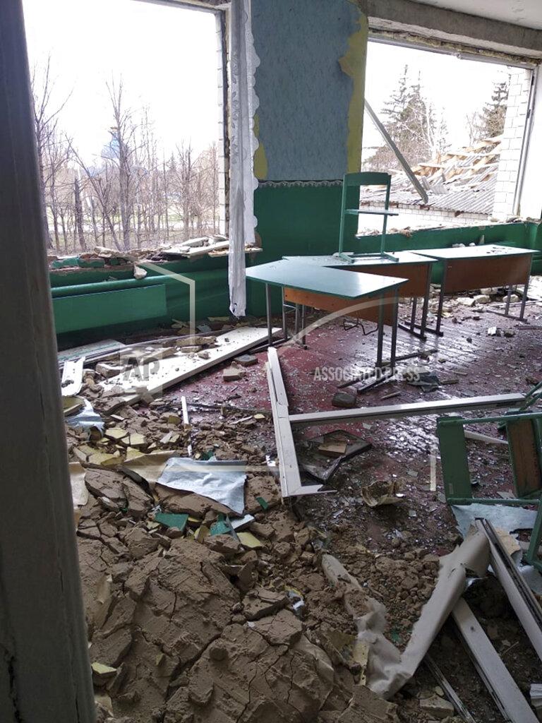 Valentina Grusha This April 26, 2022 photo provided by Ukrainian school administrator Valentina Grusha shows damage to the Cooks Comprehensive school complex in Kukhari, Ukraine. The village outside Kyiv was under Russian occupation in March and April, until Ukrainian forces drove them out. (Valentina Grusha via AP)