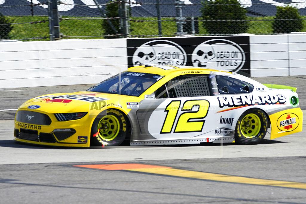 Steve Helber Ryan Blaney (12) drives into turn two during the NASCAR Cup Series auto race at Martinsville Speedway in Martinsville, Va., Sunday, April 11, 2021. (AP Photo/Steve Helber)