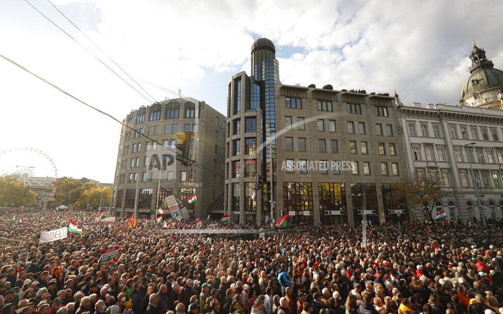 Laszlo Balogh People fill the streets during a march marking the 65th anniversary of the 1956 Hungarian revolution, in Budapest, Hungary, Saturday, Oct. 23, 2021. Thousands of supporters of Prime Minister Viktor Orban, who is expected to deliver a speech marking the 65th anniversary of the 1956 Hungarian revolution, march in Budapest, Hungary to demonstrate loyalty to his right-wing government. (AP Photo/Laszlo Balogh)