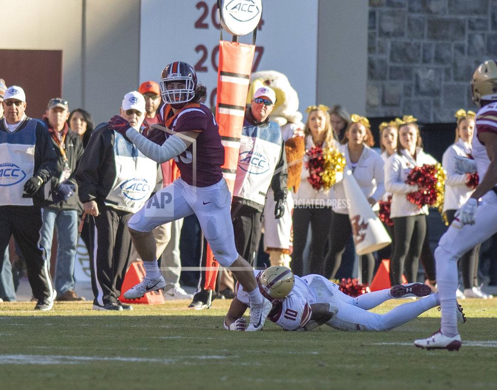 Matt Bell Virginia Tech tight end Dalton Keene drags Boston College defensive back Brandon Sebastian during the first half of an NCAA college football game against in Blacksburg, Va., Saturday, Nov. 3, 2018. (AP Photo/Matt Bell)