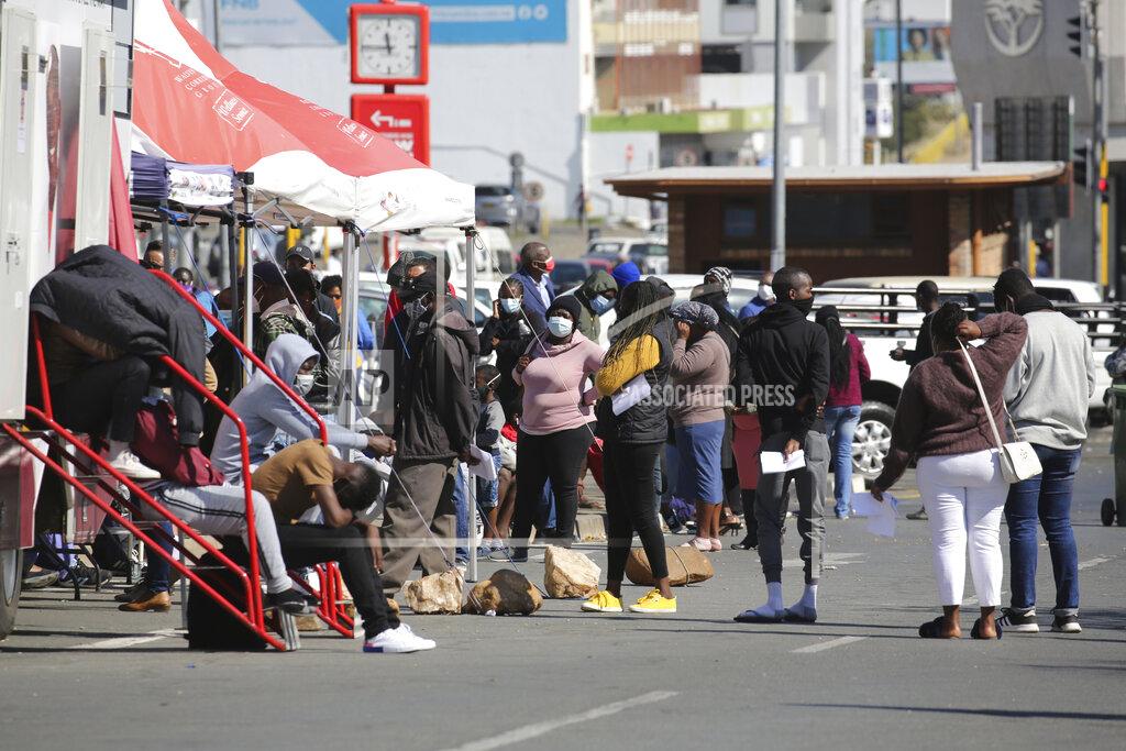 Dirk Heinrich People queue in the Windhoek, Namibia centre, to be tested for COVID-19 on Tuesday June 15, 2021. Africa is facing a devastating resurgence of COVID-19 infections whose peak will surpass that of earlier waves as the continent's countries struggle to vaccinate even a small percentage of the population, top health officials said Thursday June 24, 2021. (AP Photo/Dirk Heinrich)